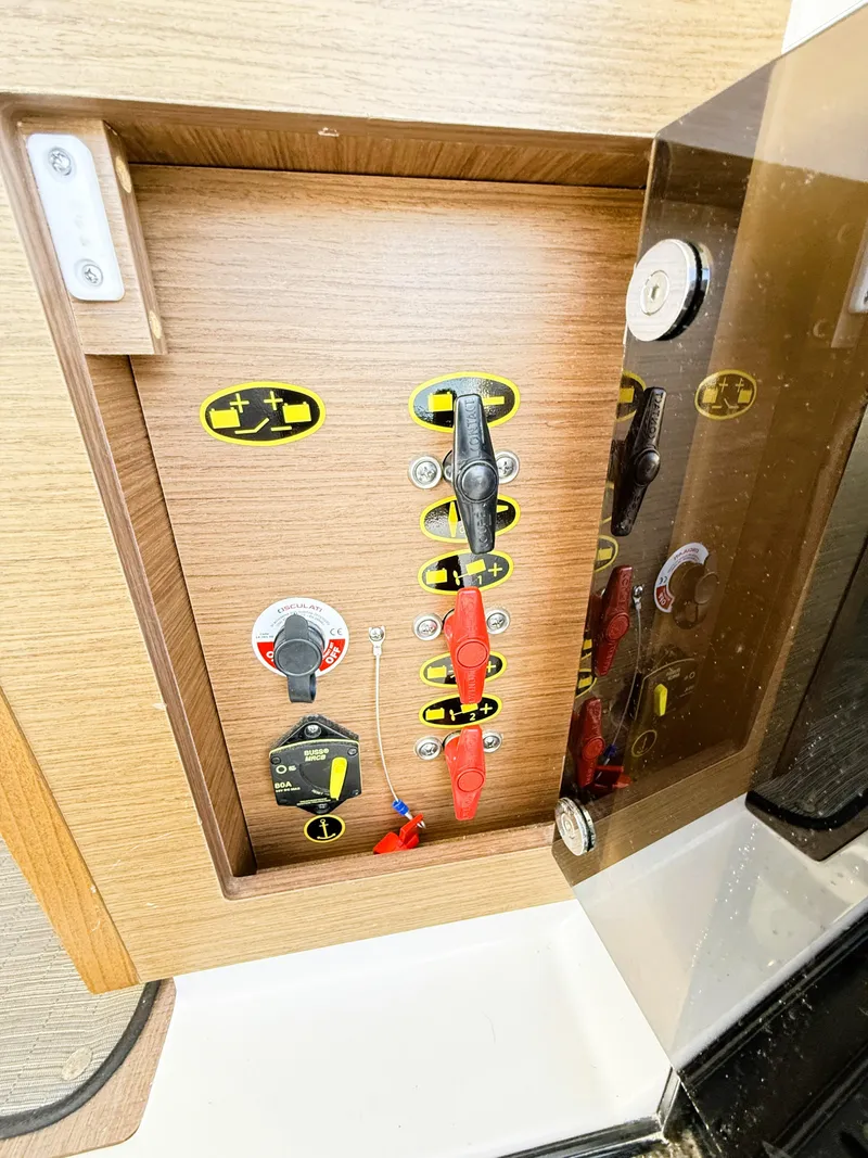 Slide: The Image of Control panel inside 2021 Jeanneau NC 895 boat, featuring switches and indicators. - 36