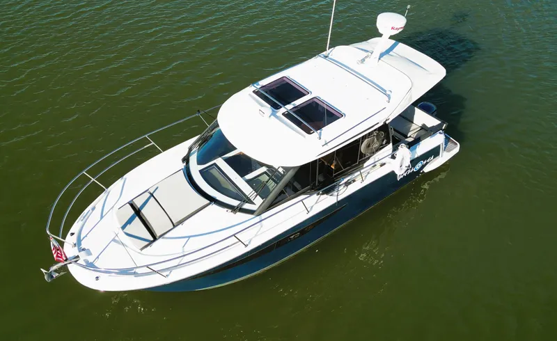 Slide: The Image of 2021 Jeanneau NC 895 boat on calm water, aerial view. - 4
