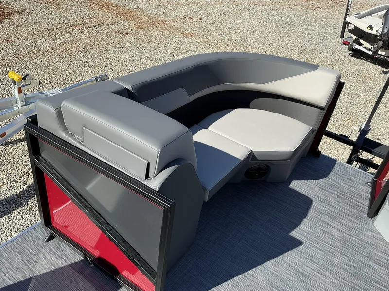 Slide: The Image of 2025 Lowe LS 170 boat interior with gray seating and red accents. - 5