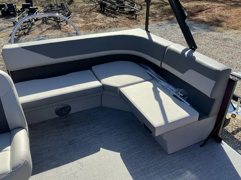 Slide: The Image of 2025 Lowe LS 170 boat interior with gray seating and storage compartments. - 7