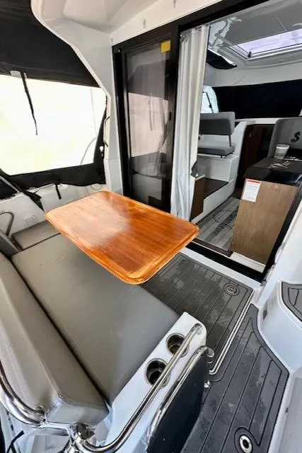 Slide: The Image of 2019 Beneteau Antares 27 interior with seating, table, and modern design. - 13