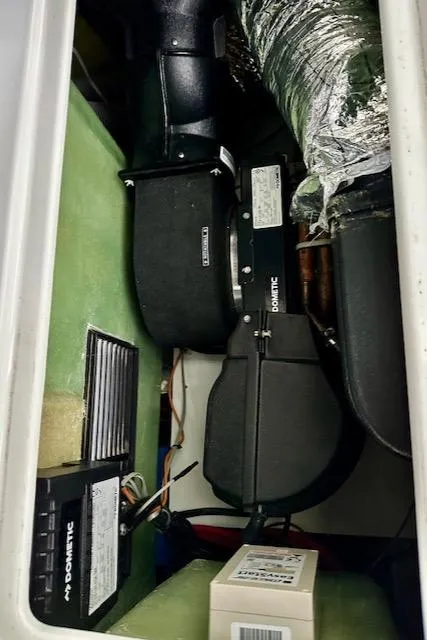 Slide: The Image of 2019 Beneteau Antares 27 engine compartment with Dometic components and wiring. - 33