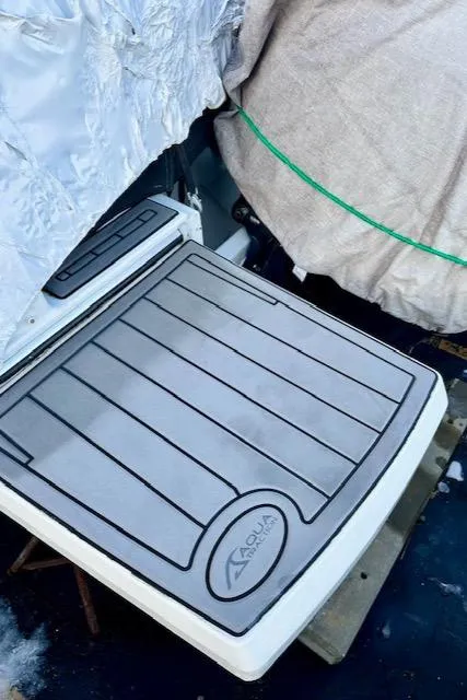 Slide: The Image of 2019 Beneteau Antares 27 boat deck with protective covering. - 35