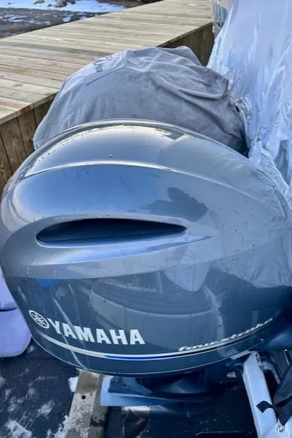 Slide: The Image of Yamaha outboard motor on a 2019 Beneteau Antares 27 boat, dockside view. - 37