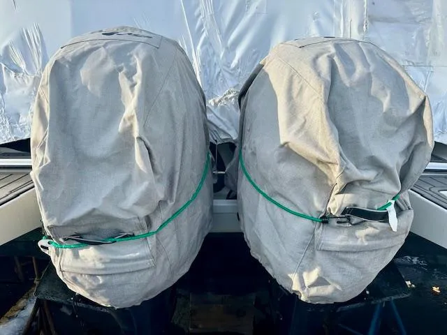Slide: The Image of Covered outboard motors on a 2019 Beneteau Antares 27 boat. - 39
