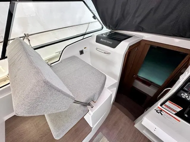 Slide: The Image of 2019 Beneteau Antares 27 interior with helm seat and control panel. - 4