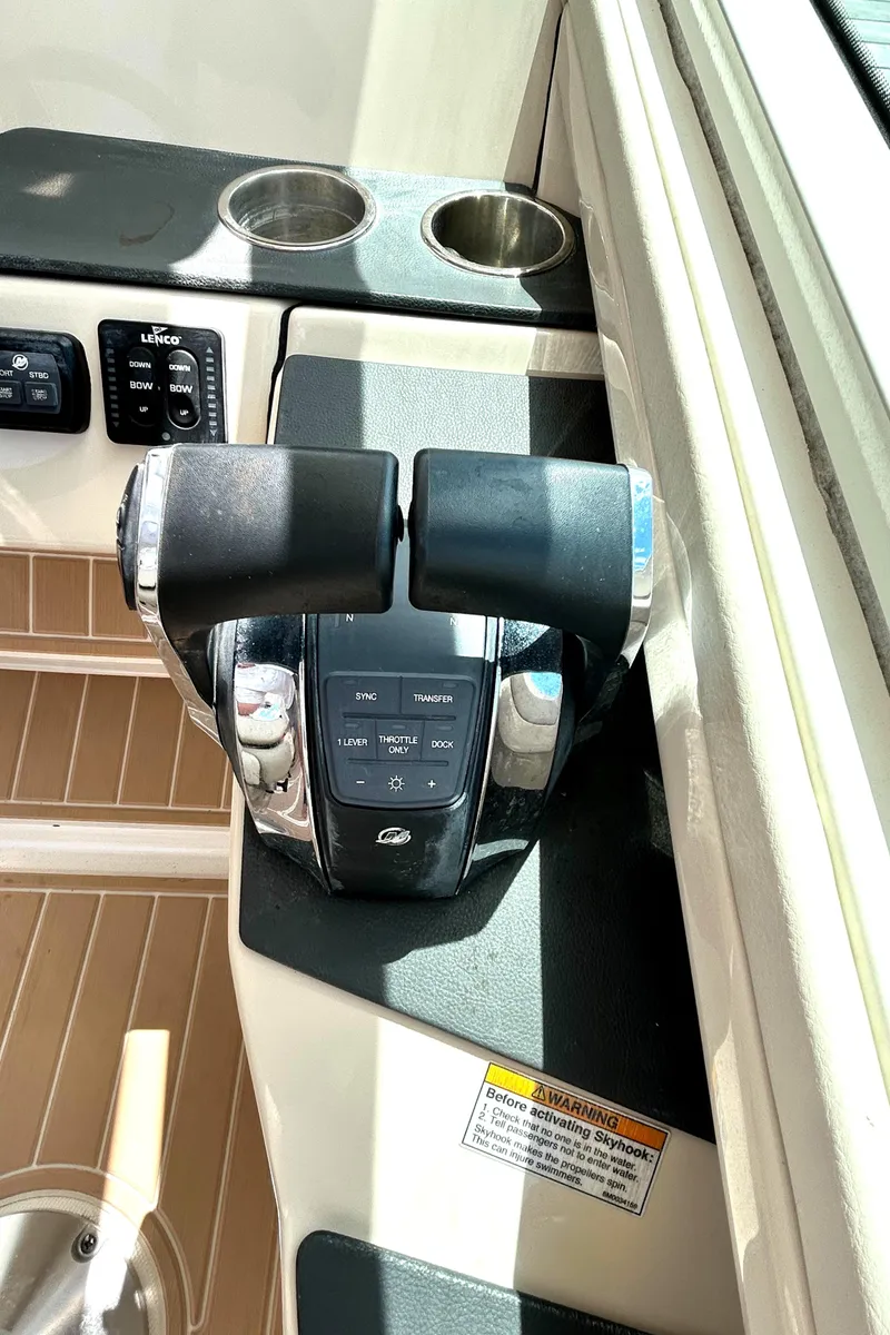 Slide: The Image of Throttle controls on a 2017 Boston Whaler 320 Vantage boat cockpit. - 14