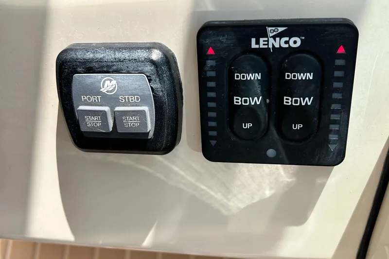 Slide: The Image of Control panel of a 2017 Boston Whaler 320 Vantage boat with Lenco trim tabs. - 16
