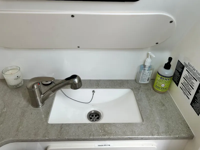 Slide: The Image of Boston Whaler 320 Vantage 2017 boat sink with faucet and soap dispensers. - 33