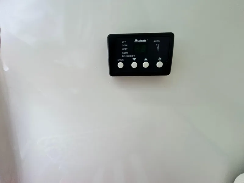 Slide: The Image of Control panel on a 2017 Boston Whaler 320 Vantage boat interior. - 36