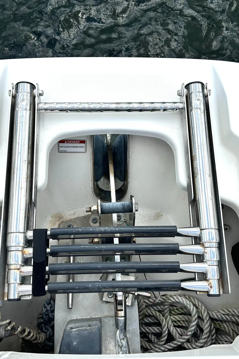 Slide: The Image of 2017 Boston Whaler 320 Vantage boat ladder and ropes by the water. - 44