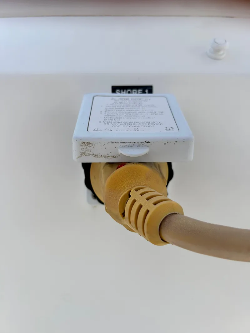 Slide: The Image of Shore power connection on a 2017 Boston Whaler 320 Vantage boat. - 47