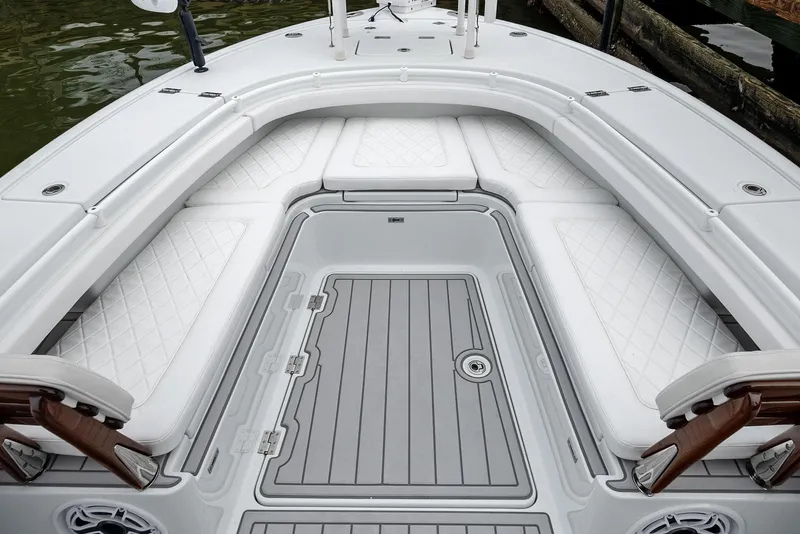 Slide: The Image of 2022 Barker Boatworks 26 Open, spacious deck with cushioned seating and sleek design. - 12