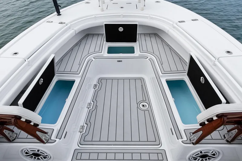 Slide: The Image of 2022 Barker Boatworks 26 Open deck with storage compartments and seating. - 13