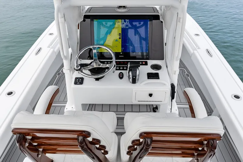 Slide: The Image of 2022 Barker Boatworks 26 Open console with dual seats and navigation display. - 22