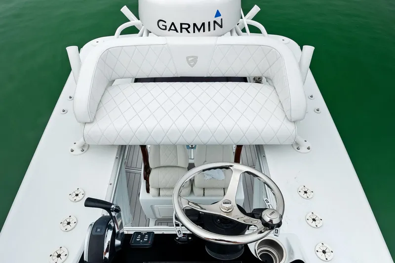 Slide: The Image of 2022 Barker Boatworks 26 Open helm with Garmin electronics and white seating. - 29