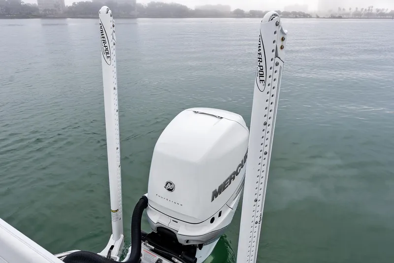 Slide: The Image of 2022 Barker Boatworks 26 Open with Mercury engine on calm water. - 33