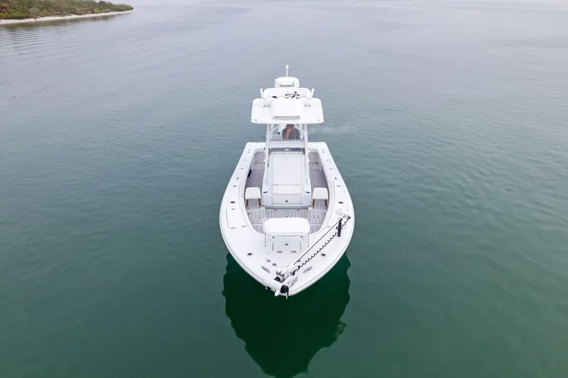 Slide: The Image of 2022 Barker Boatworks 26 Open on calm water, aerial view. - 6