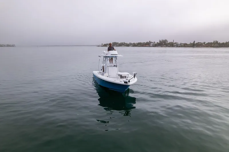 Slide: The Image of 2022 Barker Boatworks 26 Open on calm water near shoreline. - 8