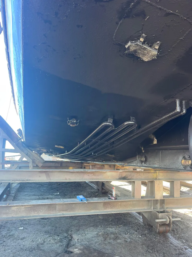 Slide: The Image of Bottom view of a 2001 Blanchard 69 Shrimper/Freezer boat on a wooden stand. - 16