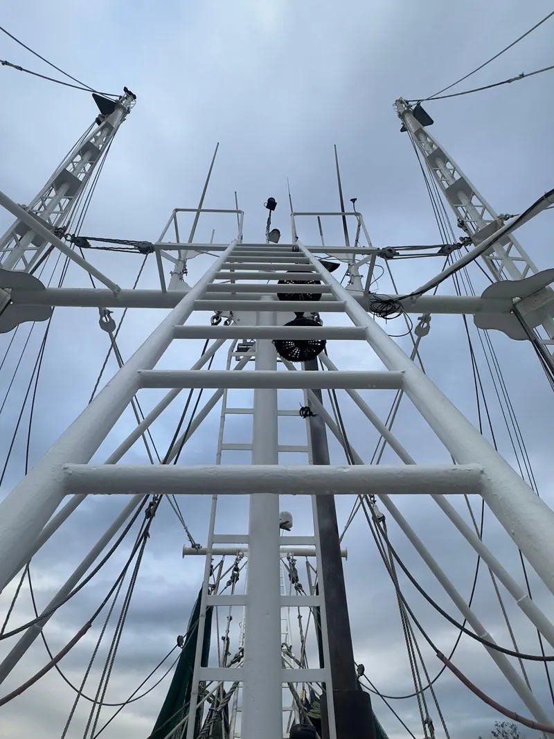 Slide: The Image of View of Blanchard 69 Shrimper/Freezer mast and rigging against cloudy sky, 2001 model. - 19