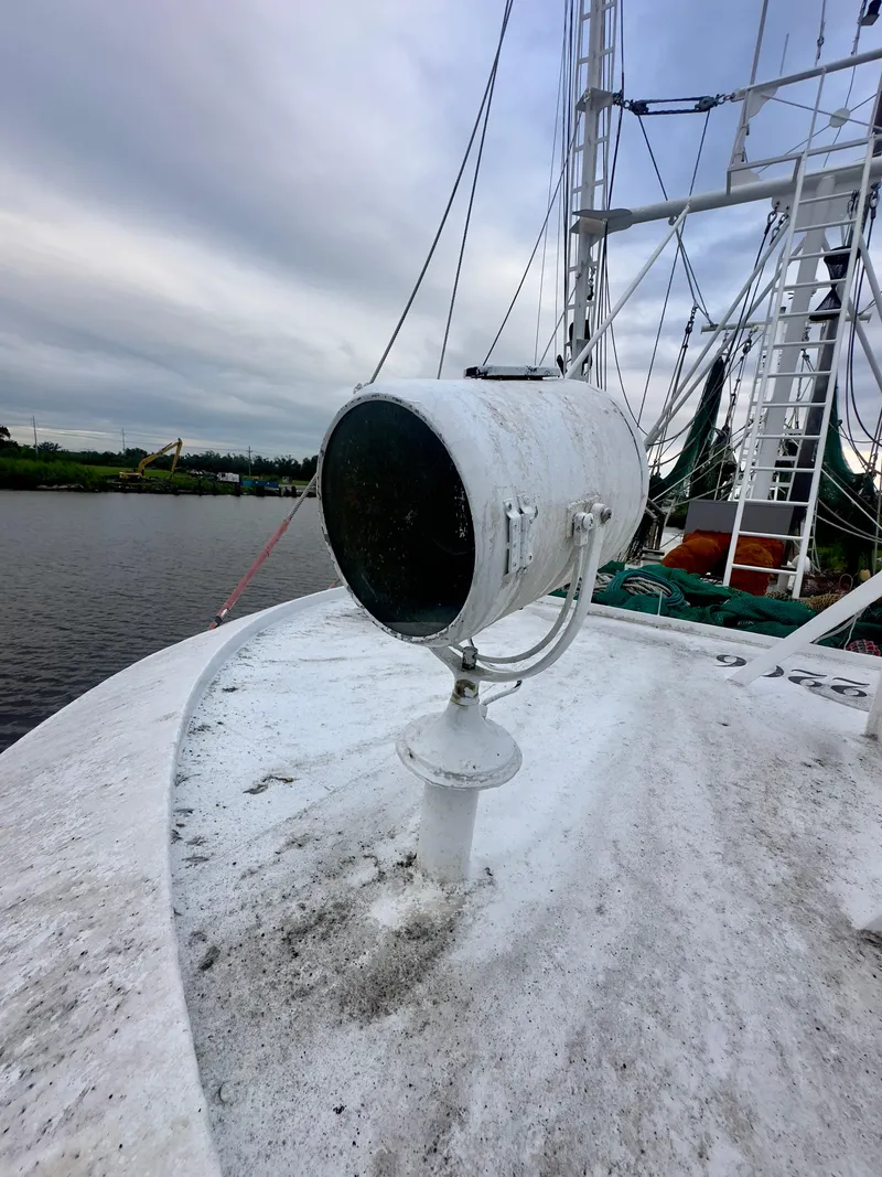 Slide: The Image of Close-up of a 2001 Blanchard 69 Shrimper/Freezer boat deck with spotlight. - 26