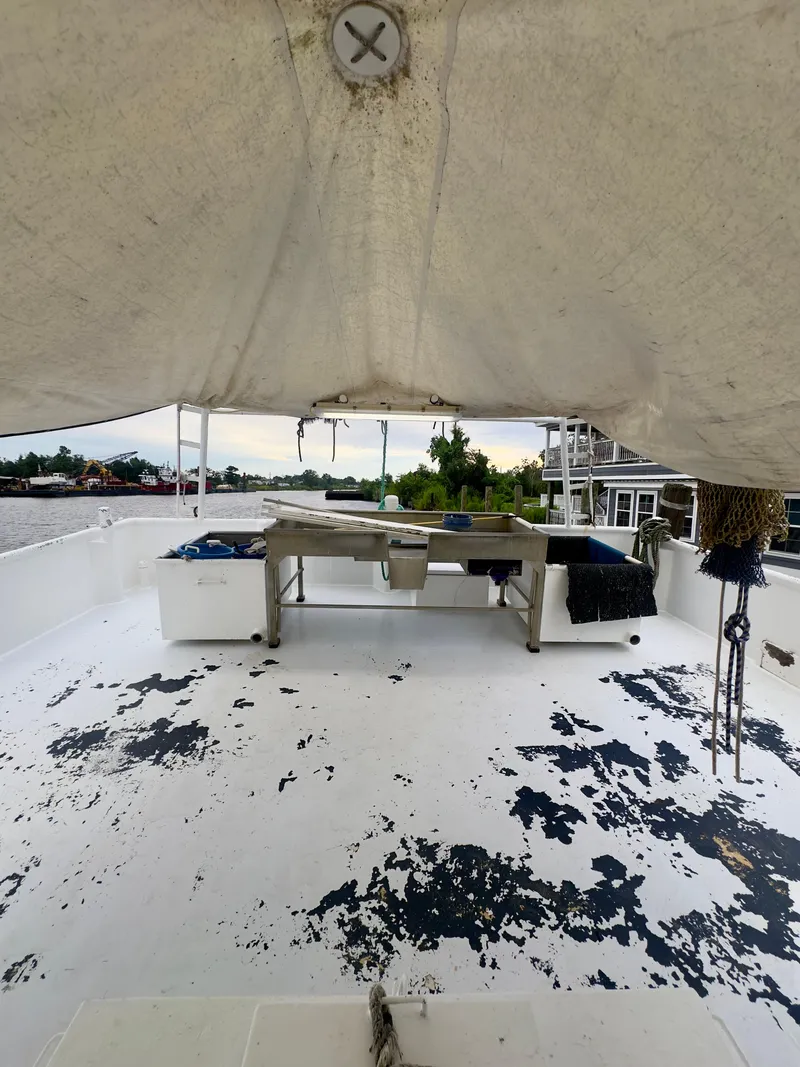 Slide: The Image of Blanchard 69 Shrimper/Freezer boat deck, 2001 model, with peeling paint and equipment. - 30