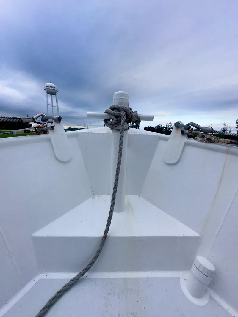 Slide: The Image of Bow of a 2001 Blanchard 69 Shrimper/Freezer boat with rope and cloudy sky. - 36