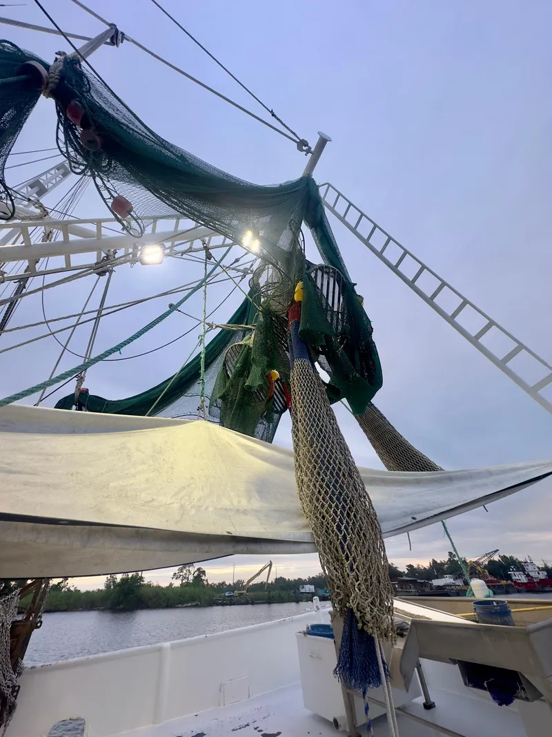 Slide: The Image of Blanchard 69 Shrimper/Freezer boat, 2001 model, with fishing nets and equipment on deck. - 42