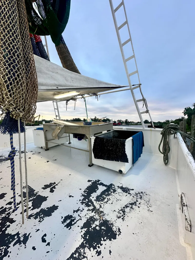 Slide: The Image of Blanchard 69 Shrimper/Freezer boat deck, 2001 model, with fishing equipment and nets. - 49