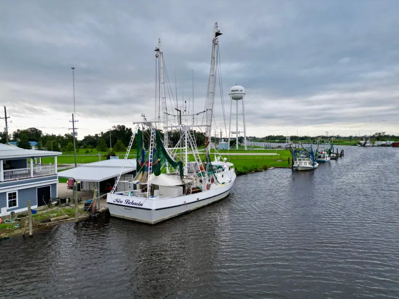 Slide: The Image of Fishing boat "Blanchard 69 Shrimper/Freezer" docked on a cloudy day, 2001 model. - 7