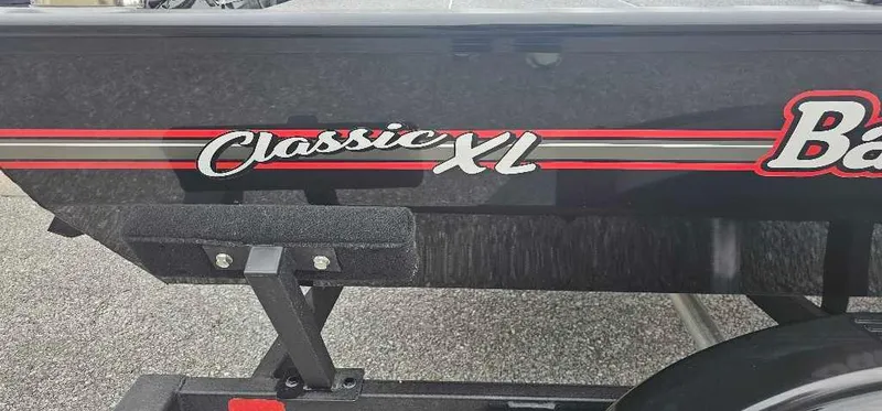 Slide: The Image of 2025 Tracker Bass Tracker Classic XL boat with red and white graphics. - 2