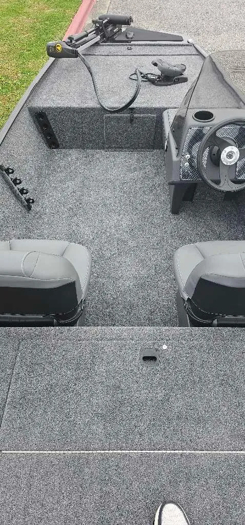 Slide: The Image of 2025 Tracker Bass Tracker Classic XL interior with steering wheel and seating. - 3