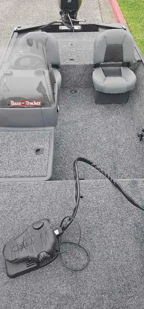 Slide: The Image of 2025 Tracker Bass Tracker Classic XL interior with seating and control panel. - 4