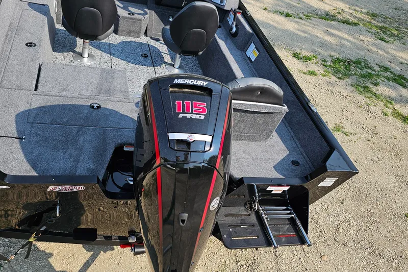 Slide: The Image of 2025 Tracker Pro Guide V-175 Combo boat with Mercury 115 engine, interior view. - 2