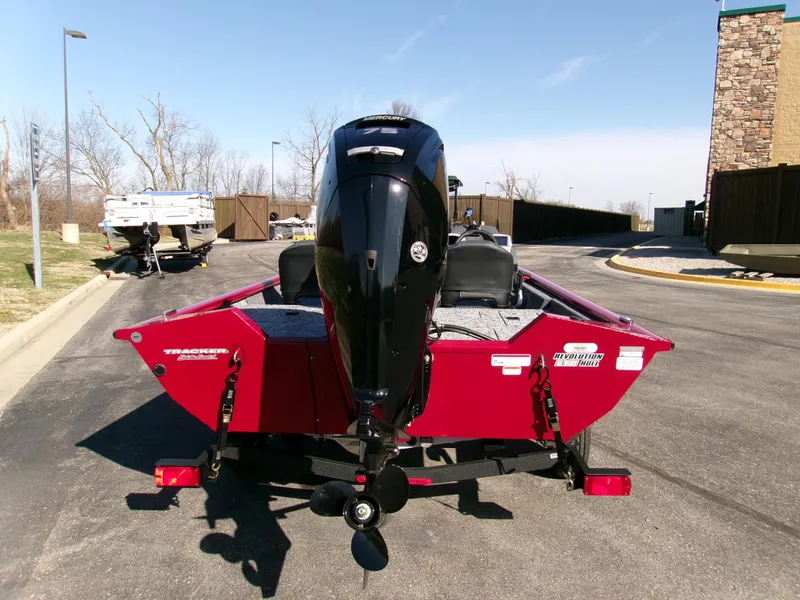 Slide: The Image of 2025 Tracker Pro Team 175 Crappie Edition boat, rear view, parked outdoors. - 2