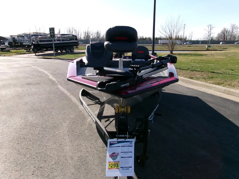 Slide: The Image of 2025 Tracker Pro Team 175 Crappie Edition boat displayed outdoors on pavement. - 3