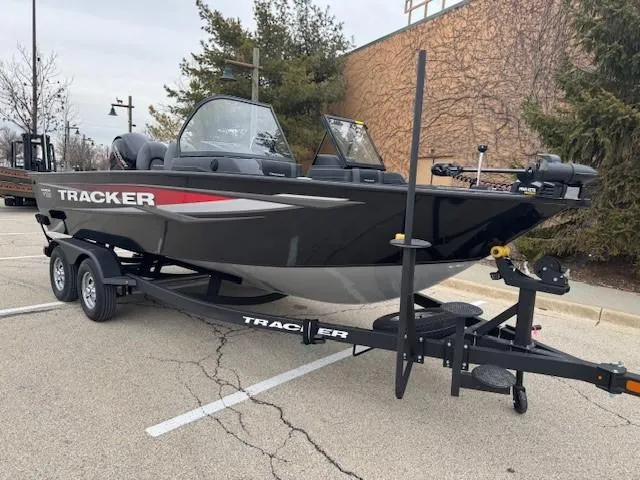 Slide: The Image of 2025 Tracker Targa V-18 WT boat on trailer in parking lot. - 6