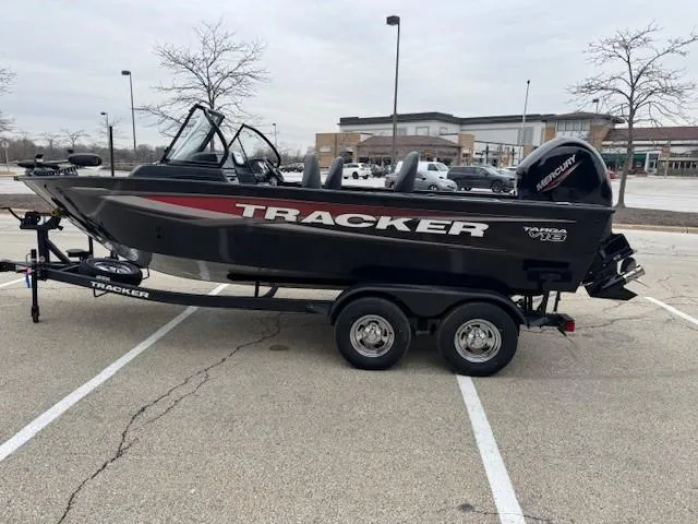 Slide: The Image of 2025 Tracker Targa V-18 WT boat on trailer in parking lot. - 7