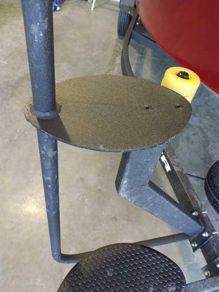 Slide: The Image of Boat trailer step for 2025 Tracker Targa V-18 Combo, featuring textured metal surface. - 3