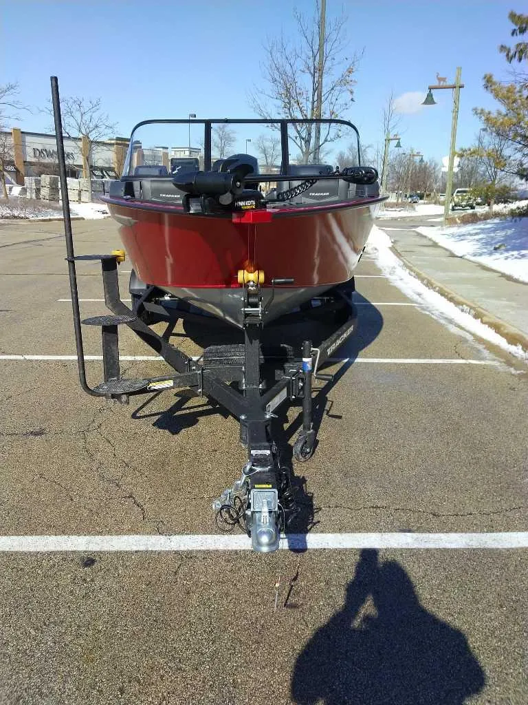 Slide: The Image of 2025 Tracker Targa V-18 Combo boat on trailer in parking lot. - 4