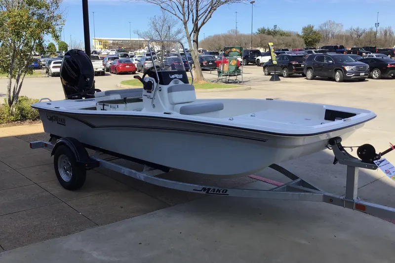 The Image of 2025 Mako Pro Skiff 15 CC boat on trailer in parking lot. - 0