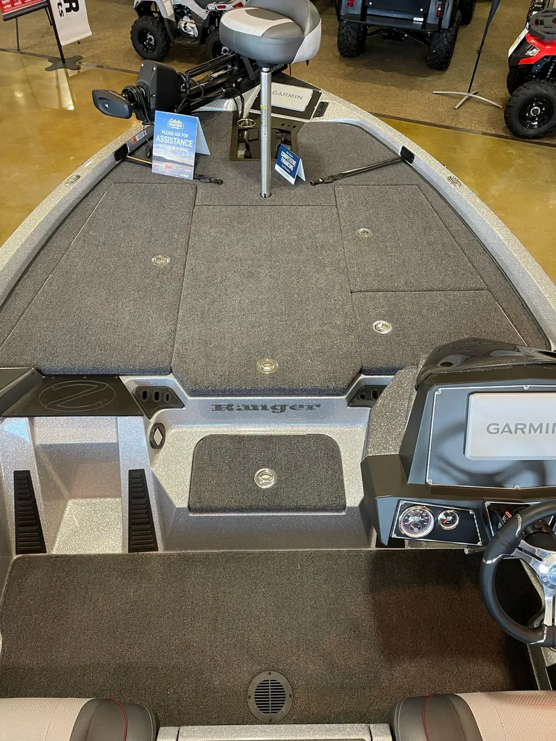Slide: The Image of 2025 Ranger Z518 Cup-Equipped boat interior with Garmin system and seating. - 4