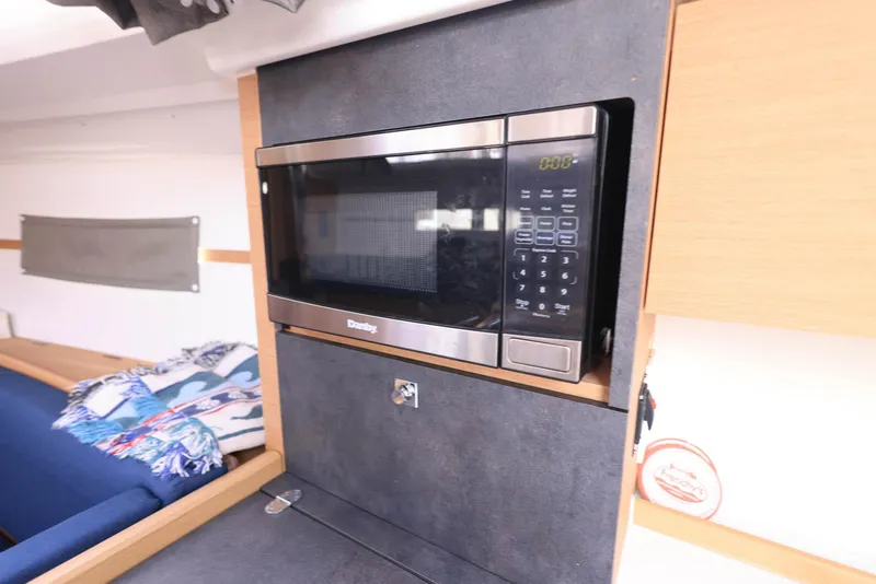 Slide: The Image of Microwave in Jeanneau Sun Odyssey 349 yacht interior, 2021 model. - 20