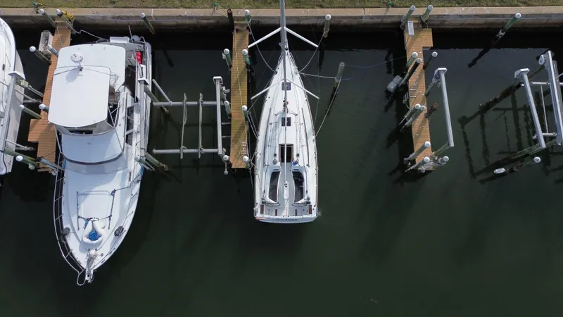 Slide: The Image of Aerial view of 2021 Jeanneau Sun Odyssey 349 docked at a marina. - 7