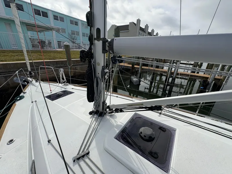 Slide: The Image of 2021 Jeanneau Sun Odyssey 349 sailboat docked, showcasing deck and rigging details. - 9