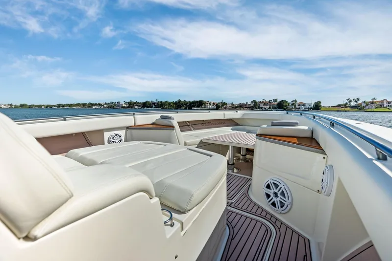 Slide: The Image of Luxurious 2018 HCB 53 Sueños boat interior with plush seating and scenic water view. - 15