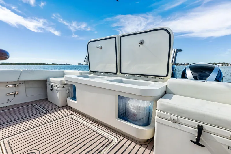 Slide: The Image of 2018 HCB 53 Sueños boat deck with storage compartments and ocean view. - 22