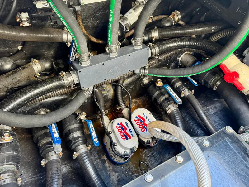 Slide: The Image of Engine compartment of a 2020 Yellowfin 42 Offshore boat with wiring and pumps. - 15