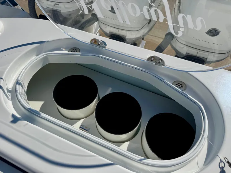 Slide: The Image of 2020 Yellowfin 42 Offshore boat with open storage compartment and three circular holders. - 20